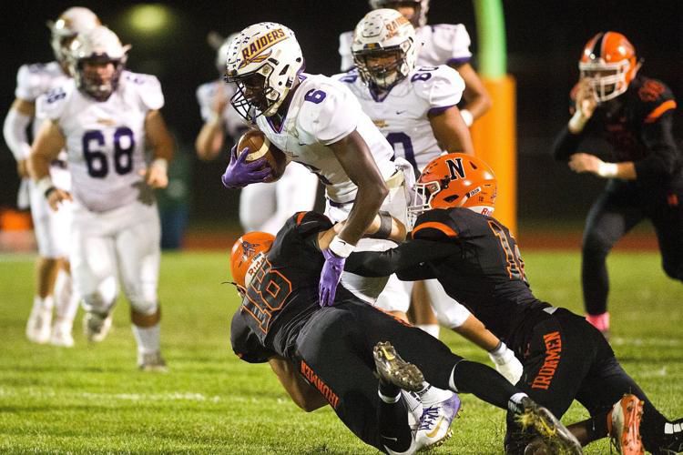 NCHS cruises past Bloomington in the schools' 105th football meeting